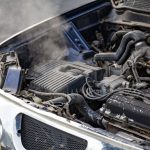 Why is my car overheating and losing coolant?