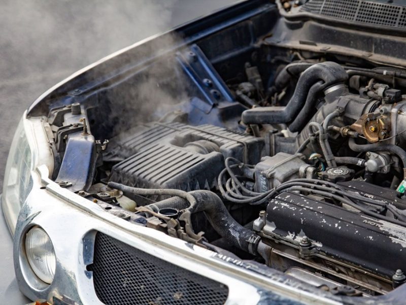 Why is my car overheating and losing coolant?